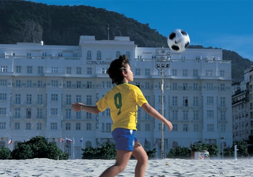 Child playing with a foot ball in Brazil