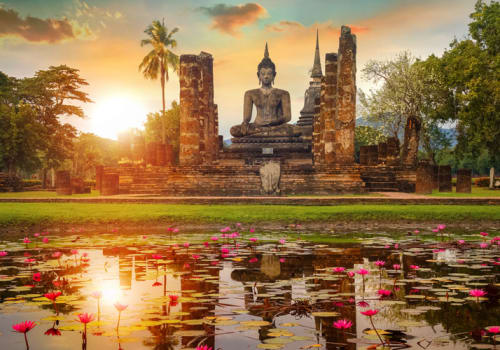 Buddha statue reflecting in the water