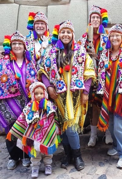 Family wearing colorful Andean clothing in Cusco