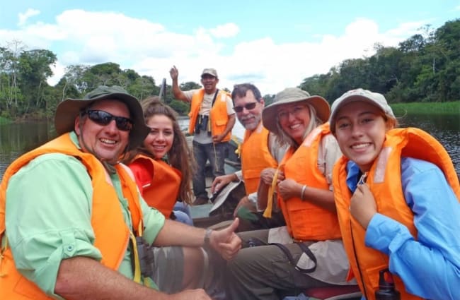 Happy Family On A Skiff in The Amazon
